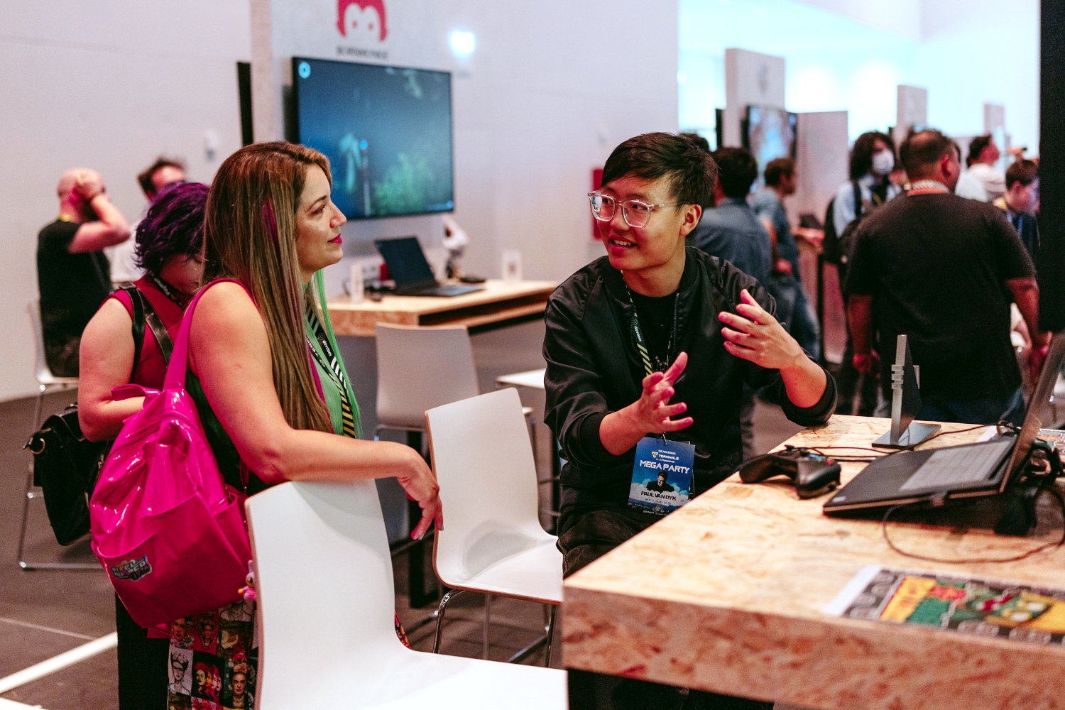 freeparticipation Two people talking at an indie booth